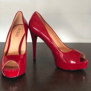 Red patent leather peep toe platform pumps